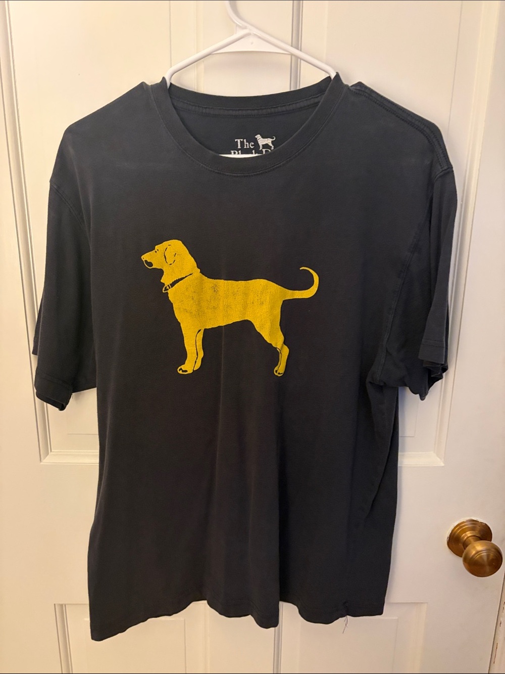 The Black Dog Black Short-Sleeve Tee with Yellow Dog Graphic